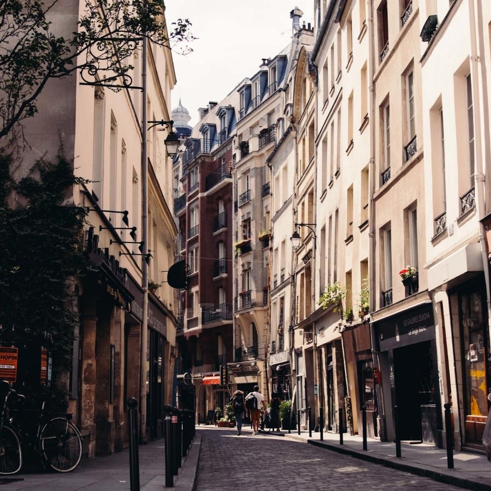 Stock image of Paris showcasing classic city architecture and riverside charm, evoking elegance, history, and timeless ambiance—ideal for contextual storytelling or as a backdrop for the Paris collection