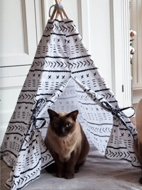 The Purr-fect Retreat!  Our cat tipi tent is the perfect sanctuary for your feline family as it offers a comfortable and private space for your cat to relax, nap, and play. Made from durable canvas with a curtain-style opening, this tipi tent is a stylish and snug haven for your pets. The fleece blanket offers even more comfort and warmth for your pets when relaxing in the tipi.