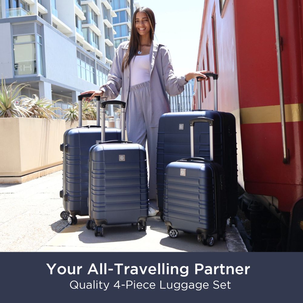 Woman with a set of blue suitcases in an urban setting